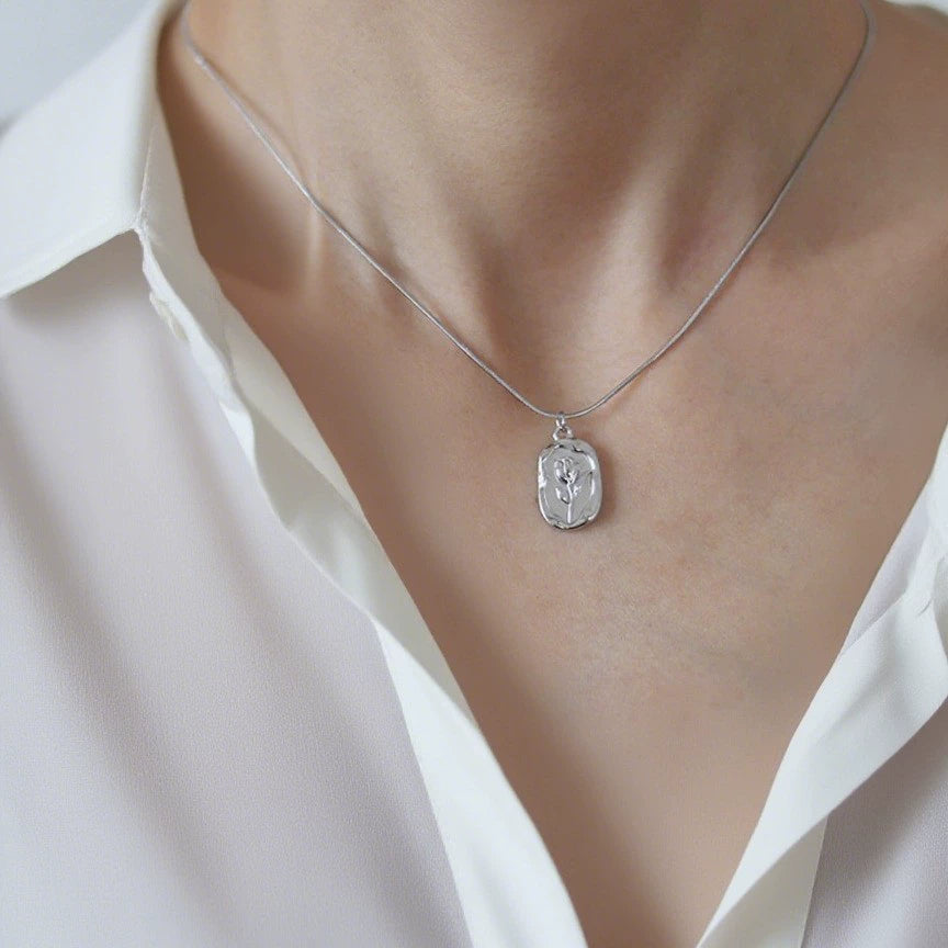 Just Lil Things Vintage Floral Engraved Pendant Necklace – Minimal Oval Tag Design with Embossed Flower Motif jltn1586