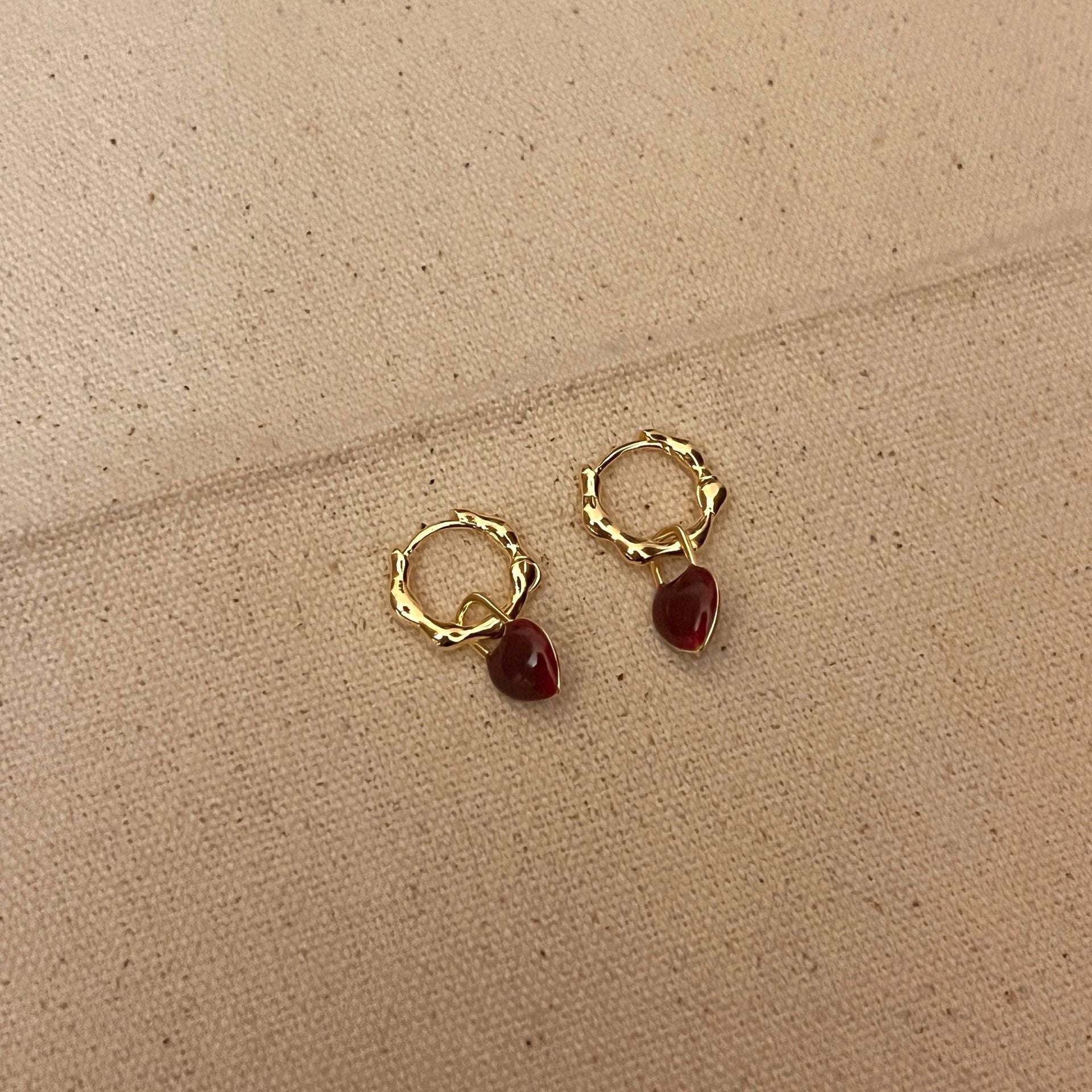 Gold Textured Hoop Earrings with Deep Red Gemstone Charm jlt11757