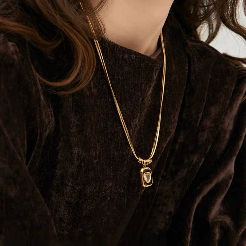 Just Lil Things Chunky Heart Pendant Necklace – Bold Rectangular Charm with Embedded Crystal and Stacked Ring Detail jltn1588