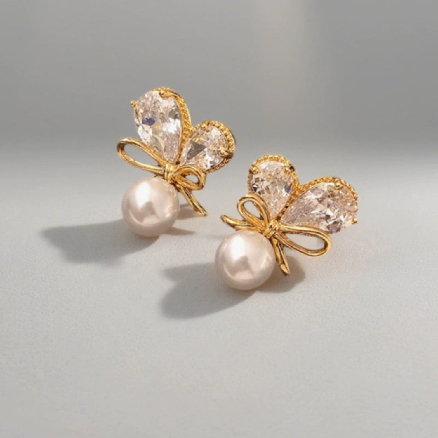 Gold Bow Pearl Butterfly Earrings JLT13536