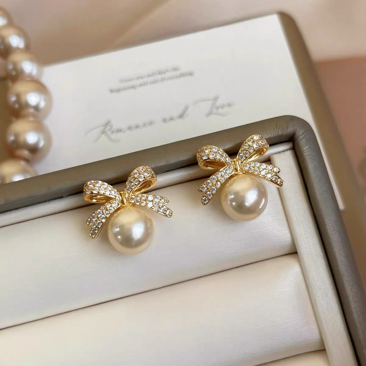 Gold Pearl Bow Earrings JLT13855