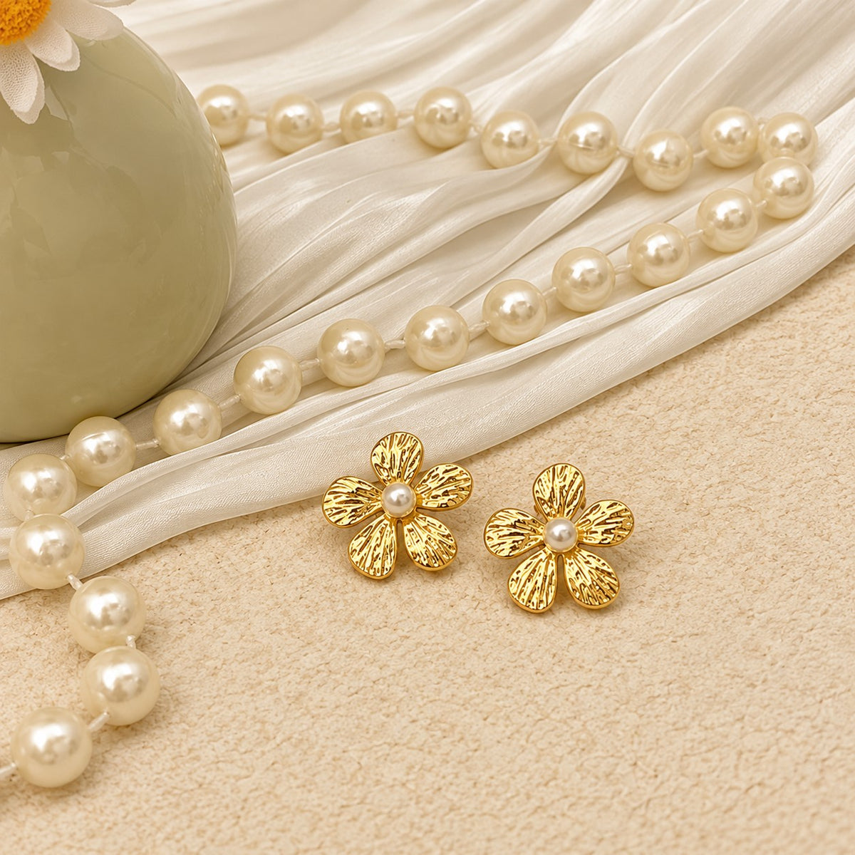 Gold Floral Stud Earrings on Elegant Display JLT14130