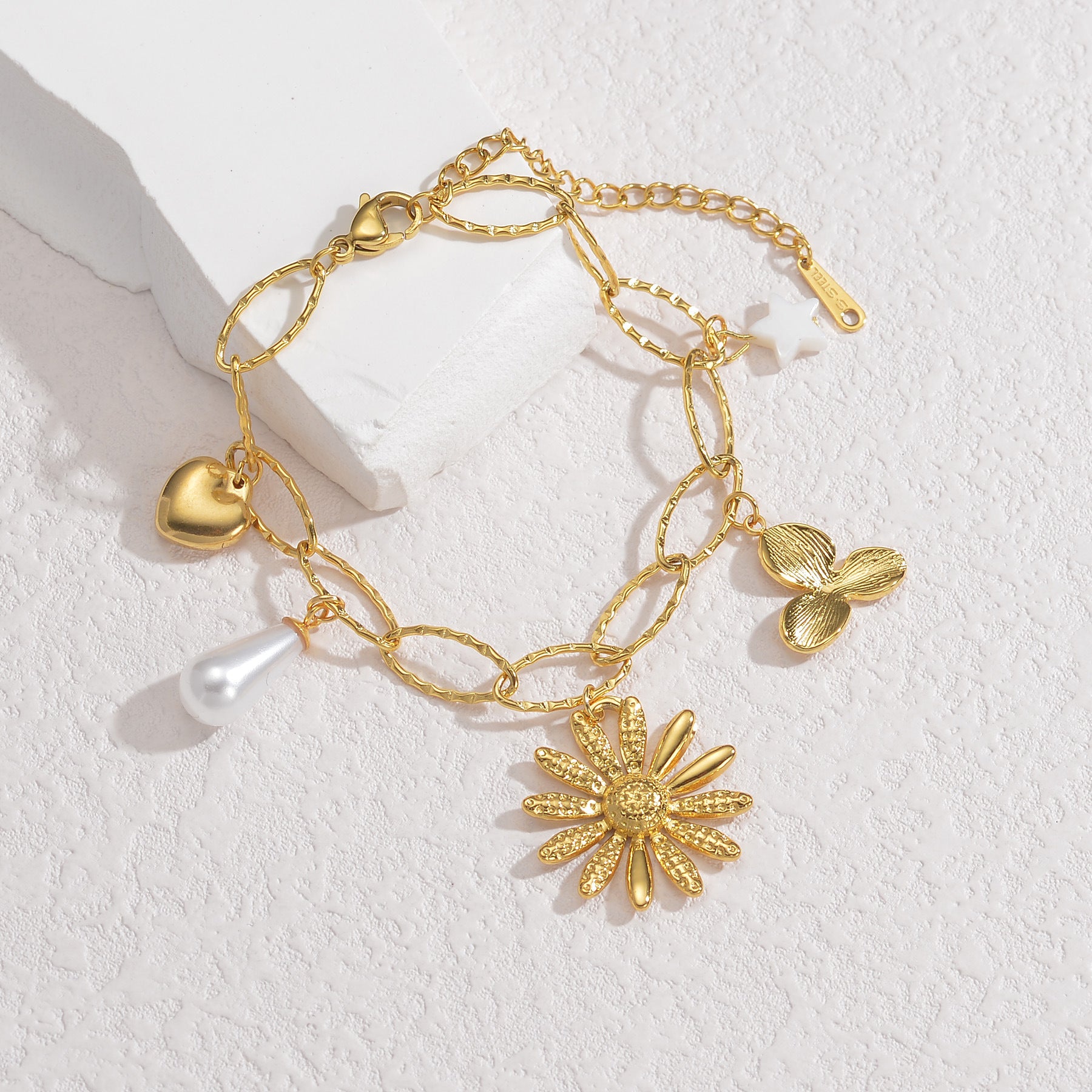Chic Gold Charm Bracelet with Petal, Leaf, and Pearl Elements JLTB0699