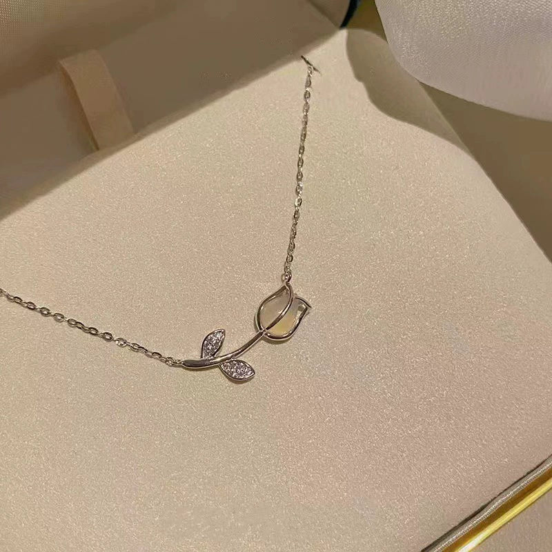 Just Lil Things  Delicate Rosebud Pendant Necklace – Minimalist Floral Stem Design with Sparkling Leaf Accents jltn1585