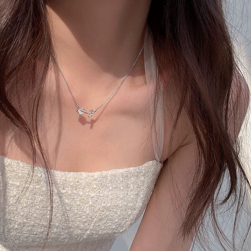Just Lil Things  Delicate Rosebud Pendant Necklace – Minimalist Floral Stem Design with Sparkling Leaf Accents jltn1585