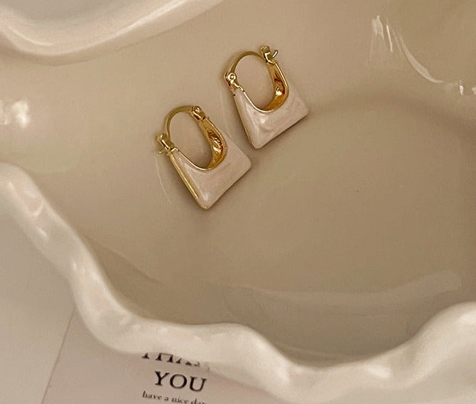 Just Lil Things Golden Minimalist Hoop Earrings with Geometric Bag Design jlt11871